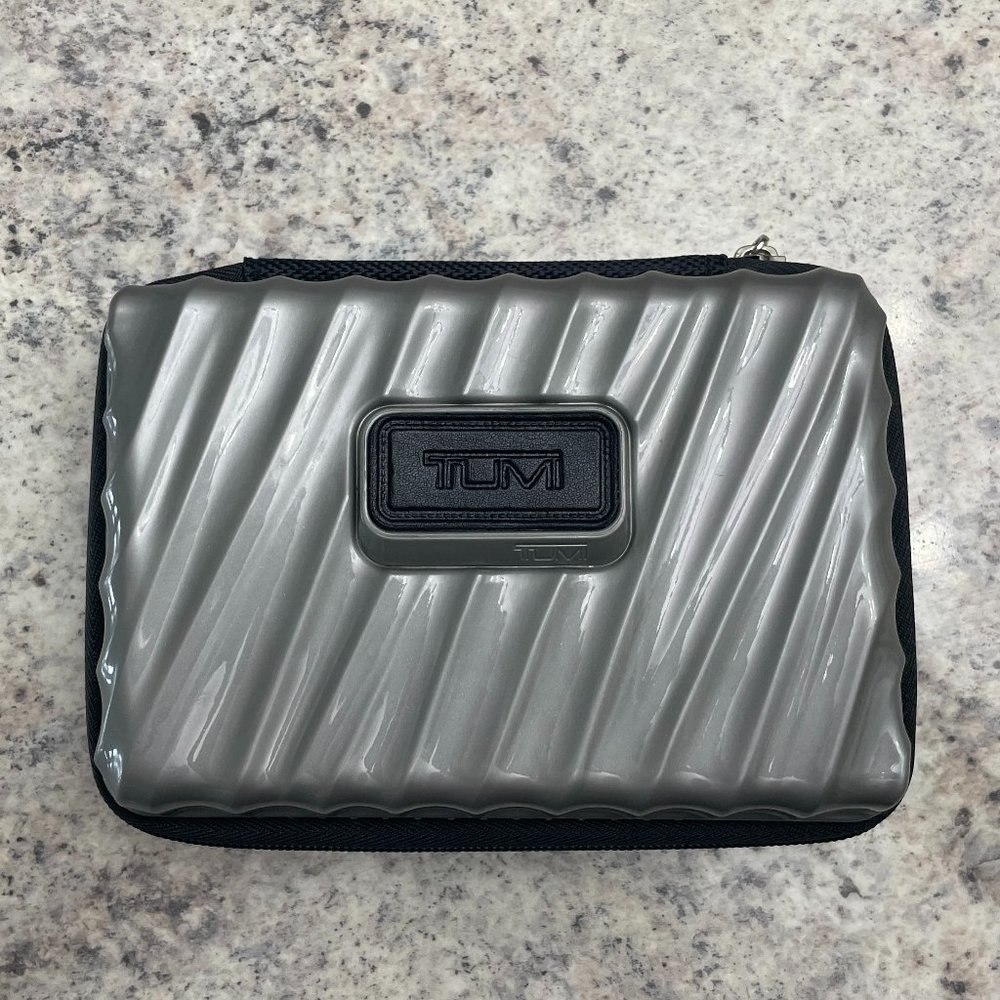 TUMI Gray/Silver Hard Shell Zippered Travel Case from Delta flight